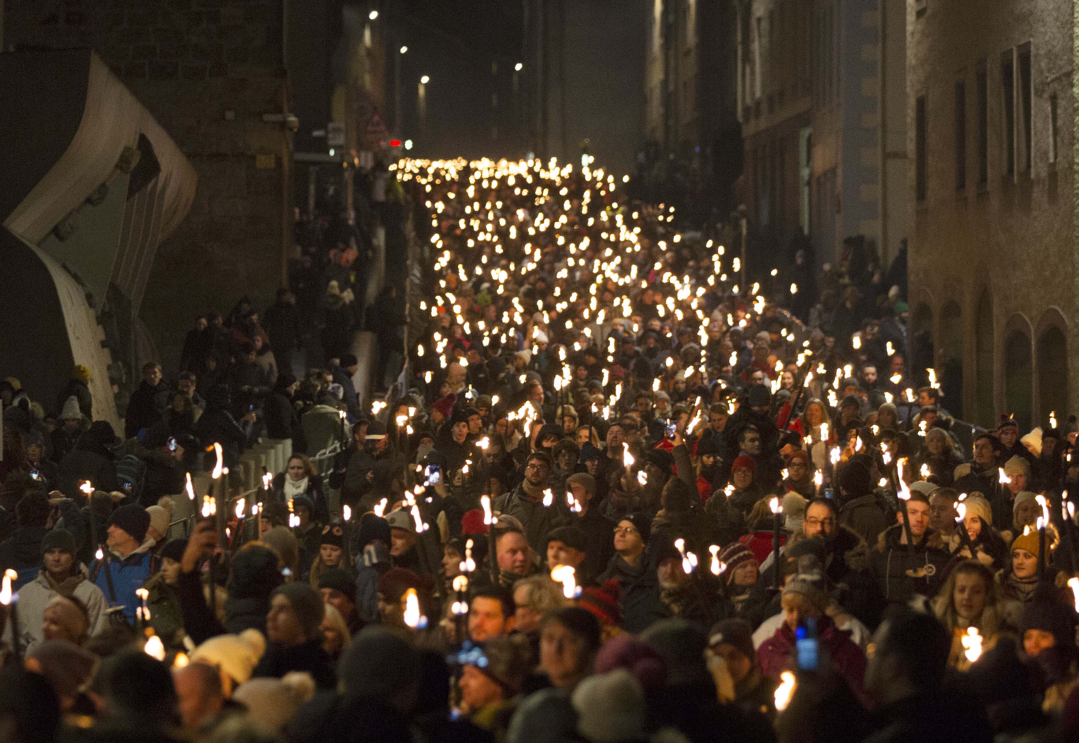 Torchbearers will blaze through the city accompanied by a cast of pipers and drummers with the procession starting at (St Giles cathedral and making its way down the Royal Mile towards Holyrood Park, passing Scottish Parliament and the Palace of Holyrood House.30.12.2017.Photograph David Cheskin.