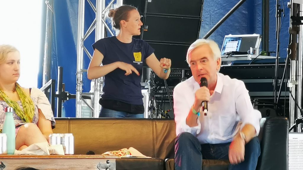 John McDonnell speaking into microphone at Leftfield Glastonbury 2019