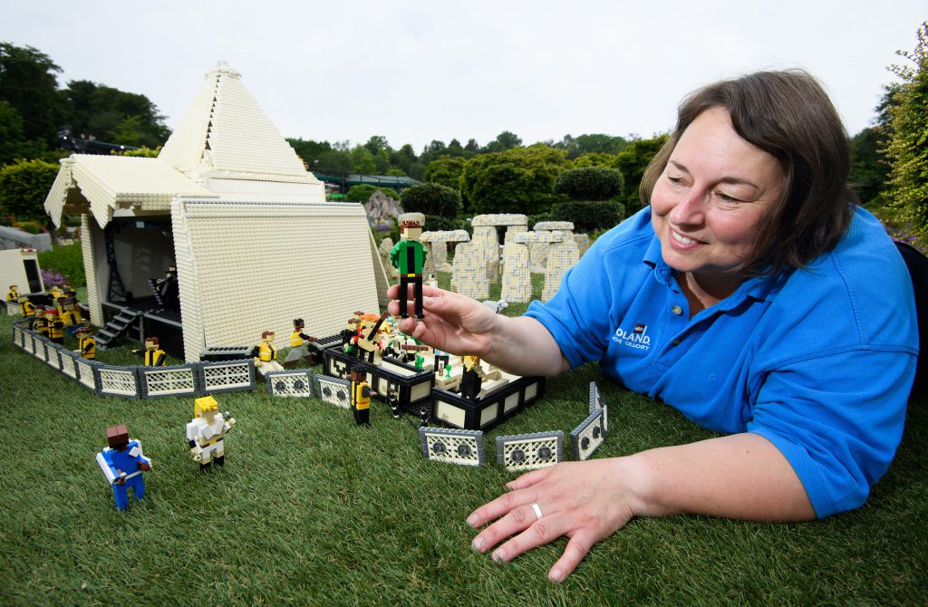 LEGOLAND PRESS HANDOUT MINILAND GLASTONBURY 2019 14 Lego Glastonbury Head Model Maker Paula Laughton makes final Touches to the Liam Gallagher figure.