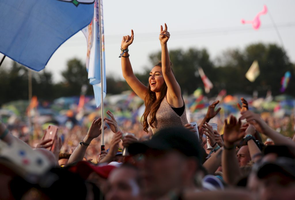Glastonbury crowd woman on shoulders