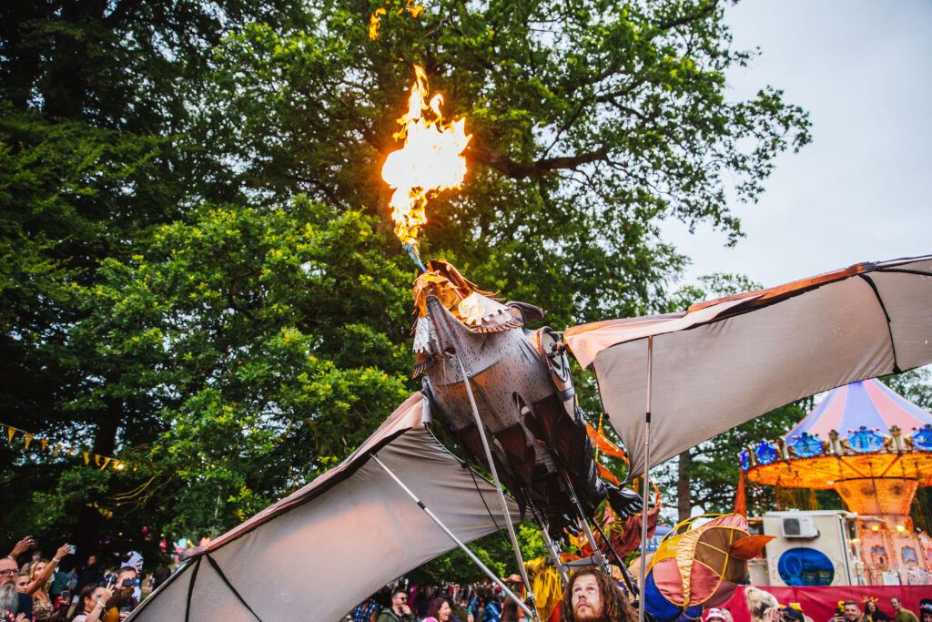 Kendal2022 Sat GeorgeHarrison Parade 27 Kendal Calling theatricals fire bird