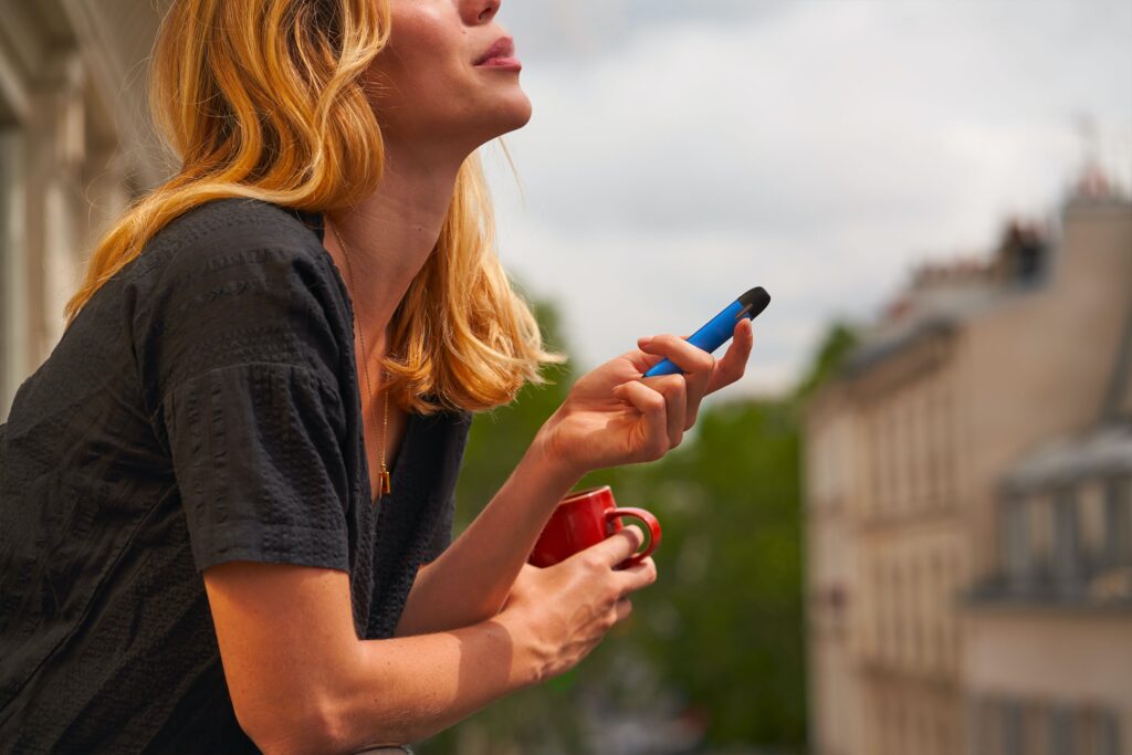 romain b 5m0qCjQOeaY unsplash Woman with coffee and HHC vape