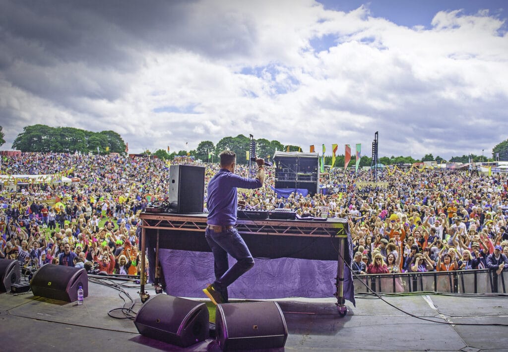 Pat Sharp will play a DJ set of hits through the decades On stage at Gloworm showing crowd
