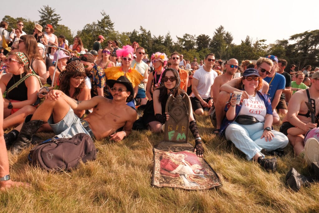 Field Maneuvers crowd sat on hill