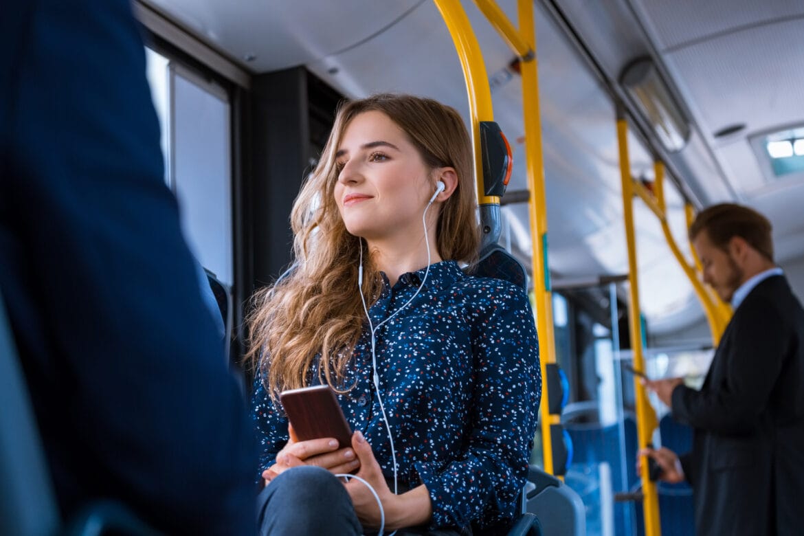 Young businesswoman traveling in bus