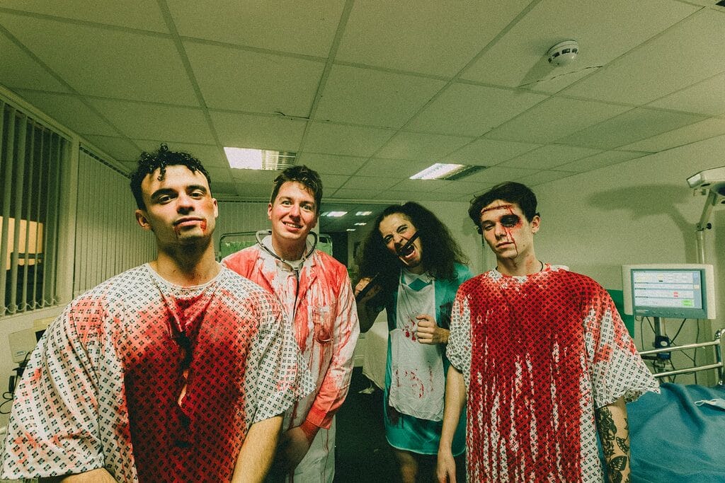 7N4A4724 Enhanced NR Keeper new single photos band in operating theatre covered in blood