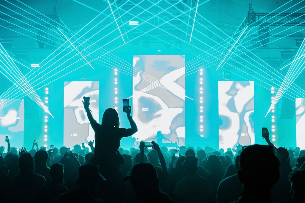 Snowbombing girl on shoulders in crowd