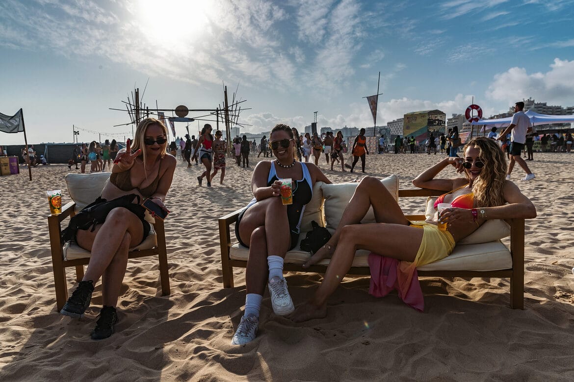Rhythm + Waves people on beach