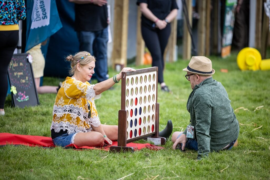Belladrum 2025 Finals. High Res. 73 Belladrum Tartan Heart people playing connect 4 game