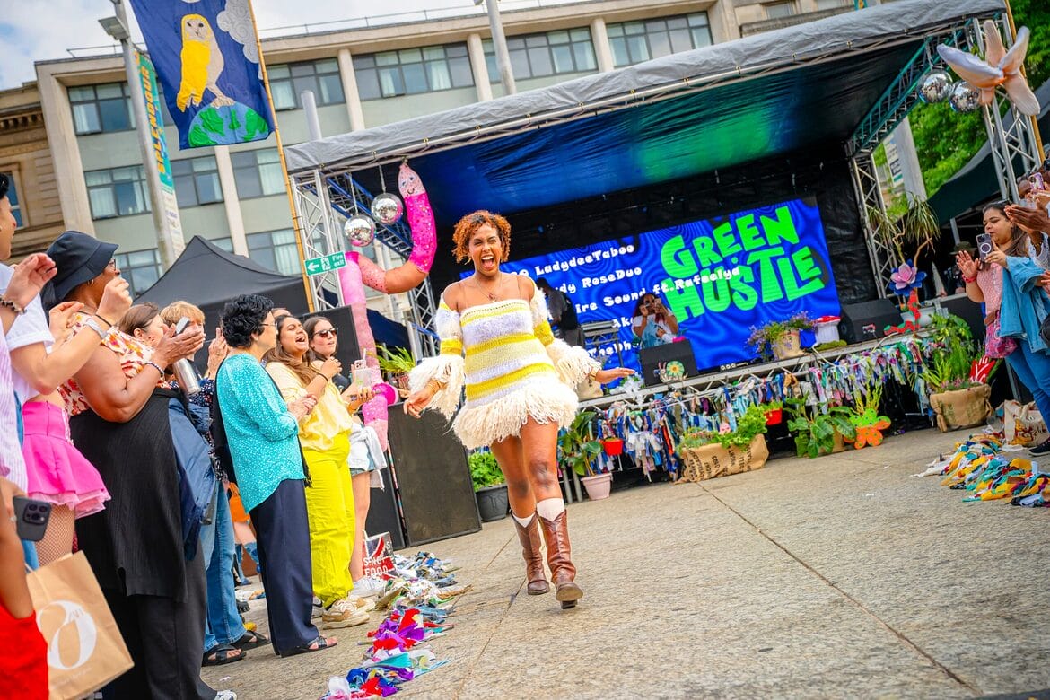 Green Hustle Festival catwalk and sign with logo