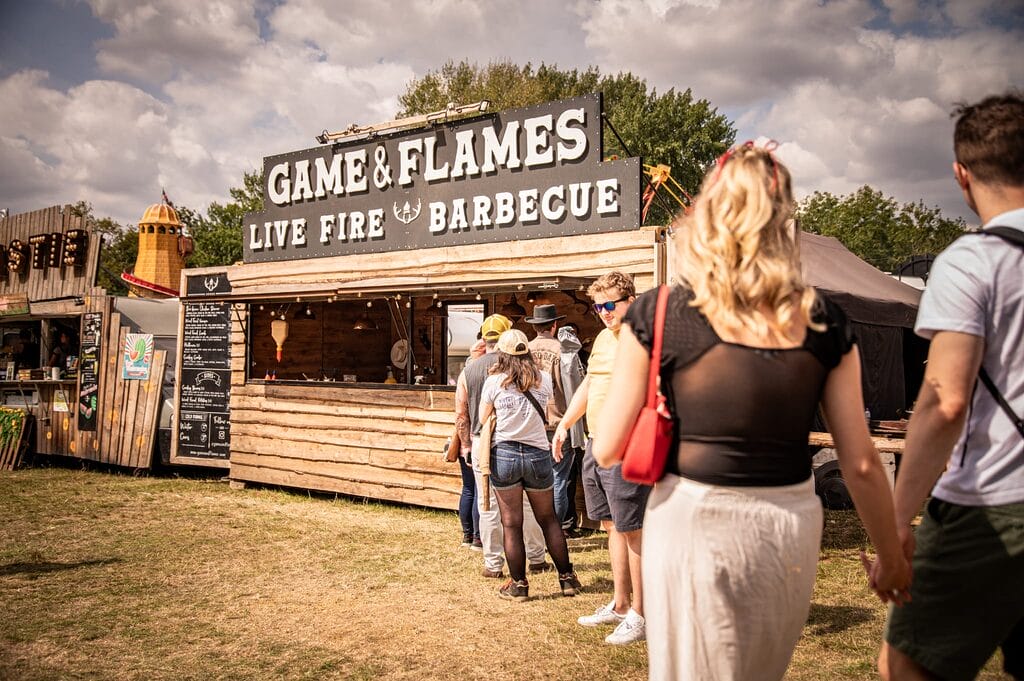 SF26 GameAndFlames 2 Game & Flames BBQ trader with queue at music festival